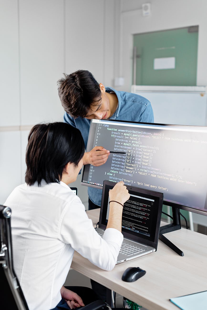 men looking the monitor together